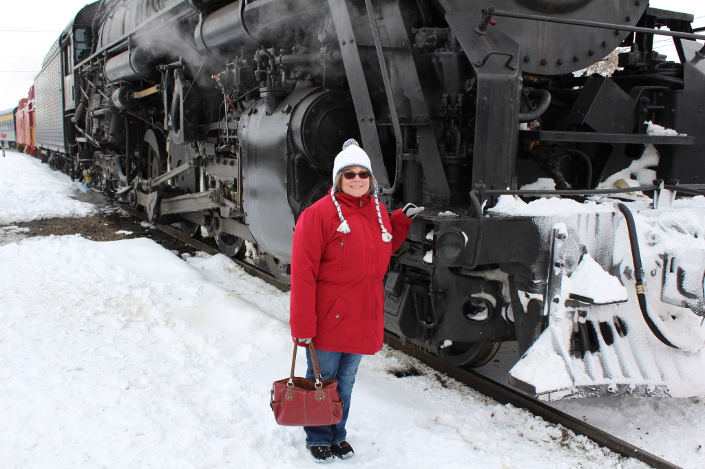 My lovely wife standing in front of the Polar Express, Pere Marquette #1225.