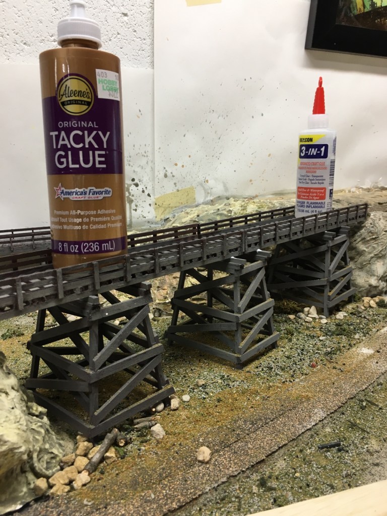 Bridge glued and weighted to secure it in place.