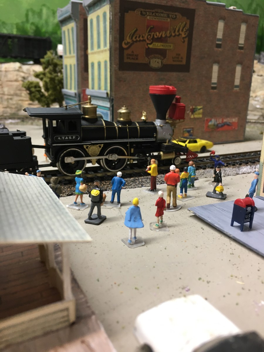 Locomotive, people, buildings,