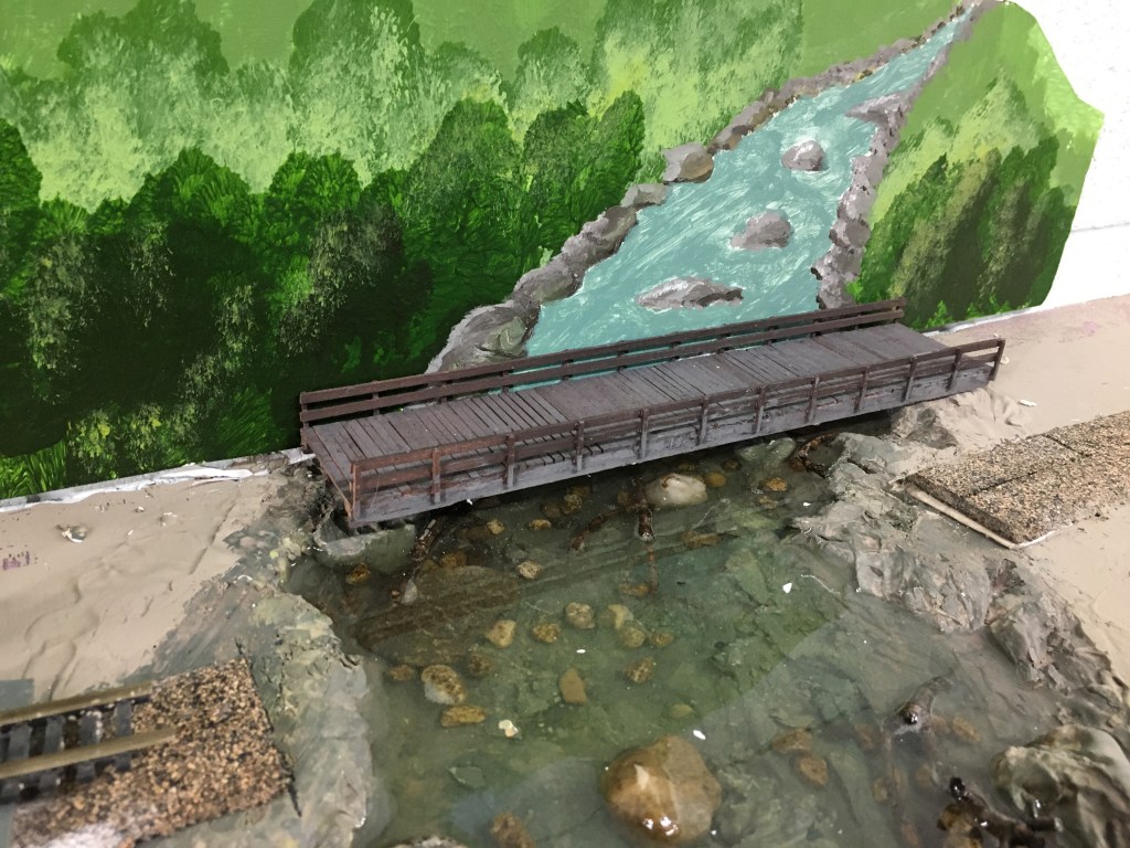 Painted river with rocks on the bank.