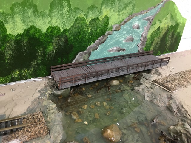 Painted river with rocks on the bank.