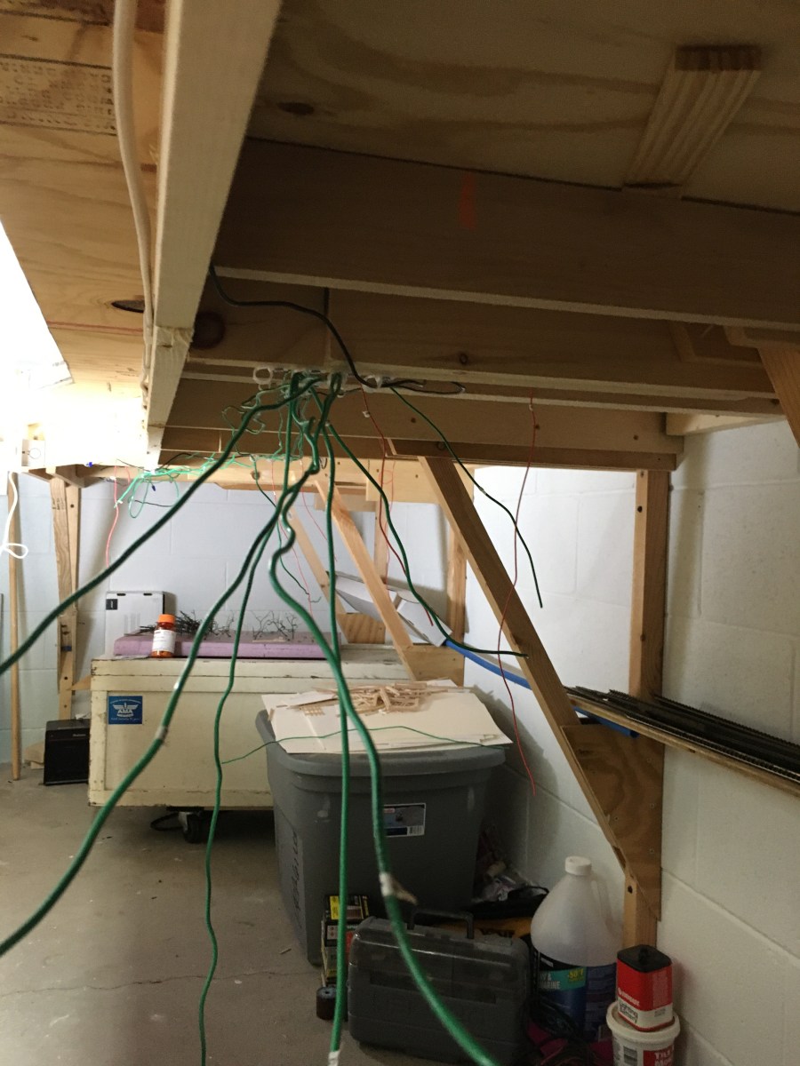 Under layout benchwork showing wires still to be connected.