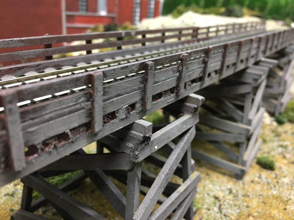 Three Tower Bridge with track deck and timbers holding the bridge in place.