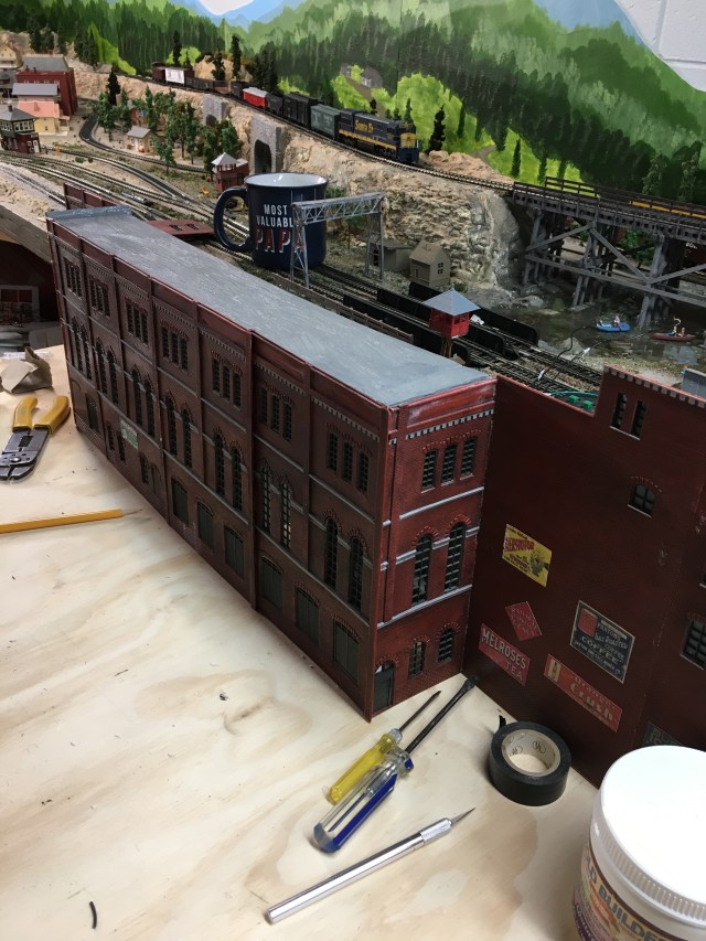 Backdrop Factory with advertising and gray roof