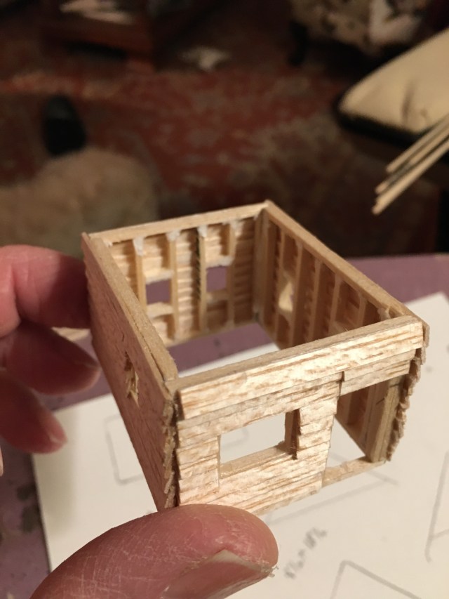 HO scale cabin in balsa with studs, window frames, and siding.