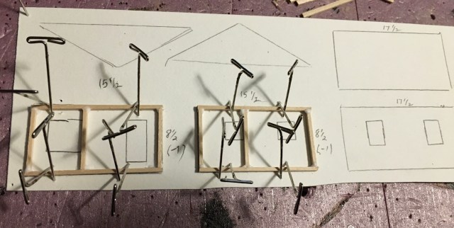 Two wall frames and two wall outlines in pencil drawn on cardstock.