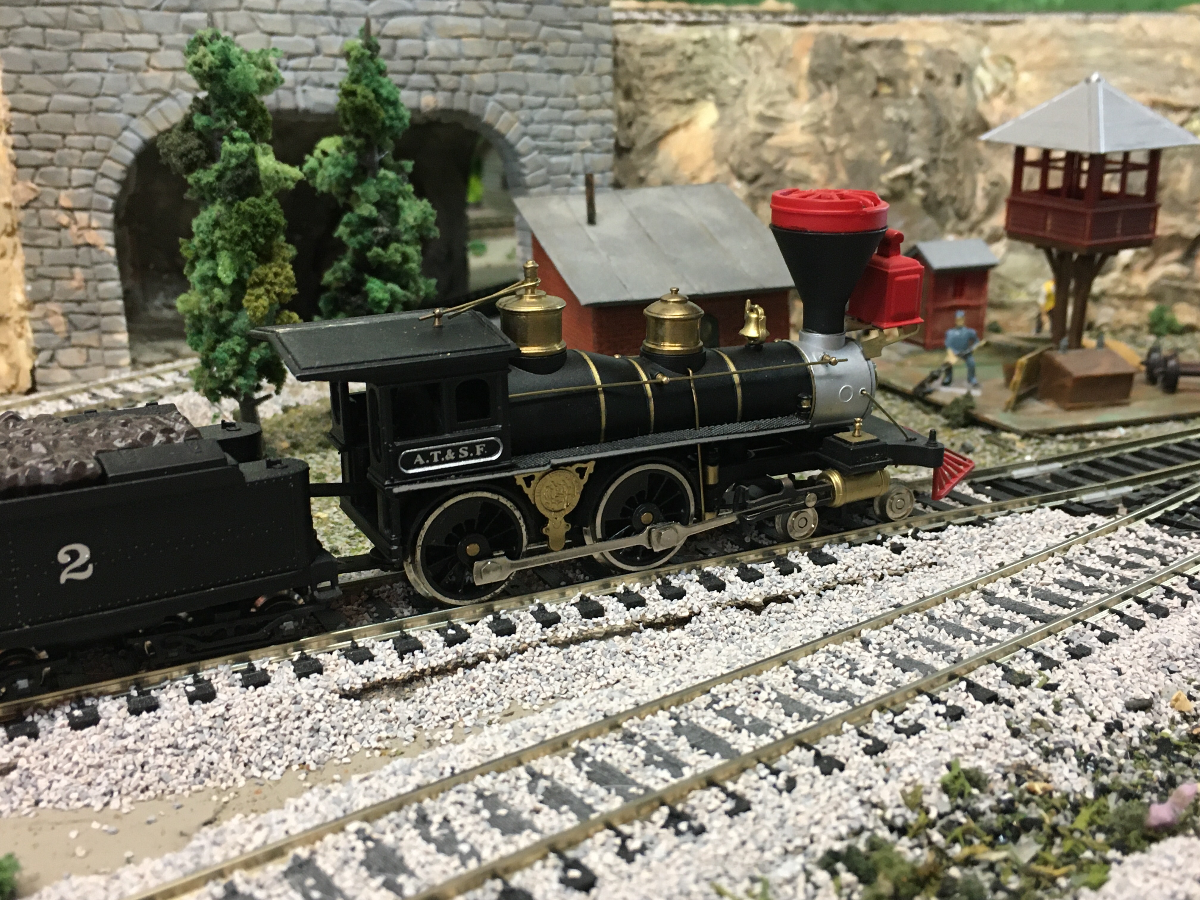 Civil War Era locomotive, trees, buildings, train track