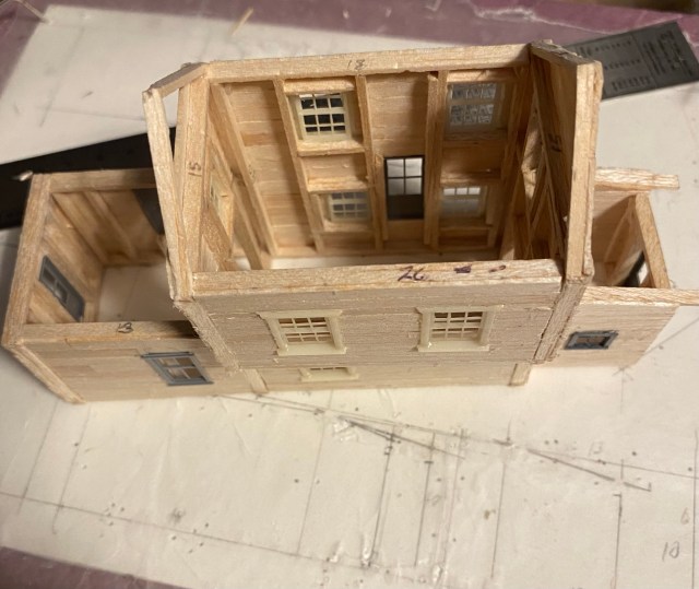 Two story inside view of balsa structure showing wall studs.