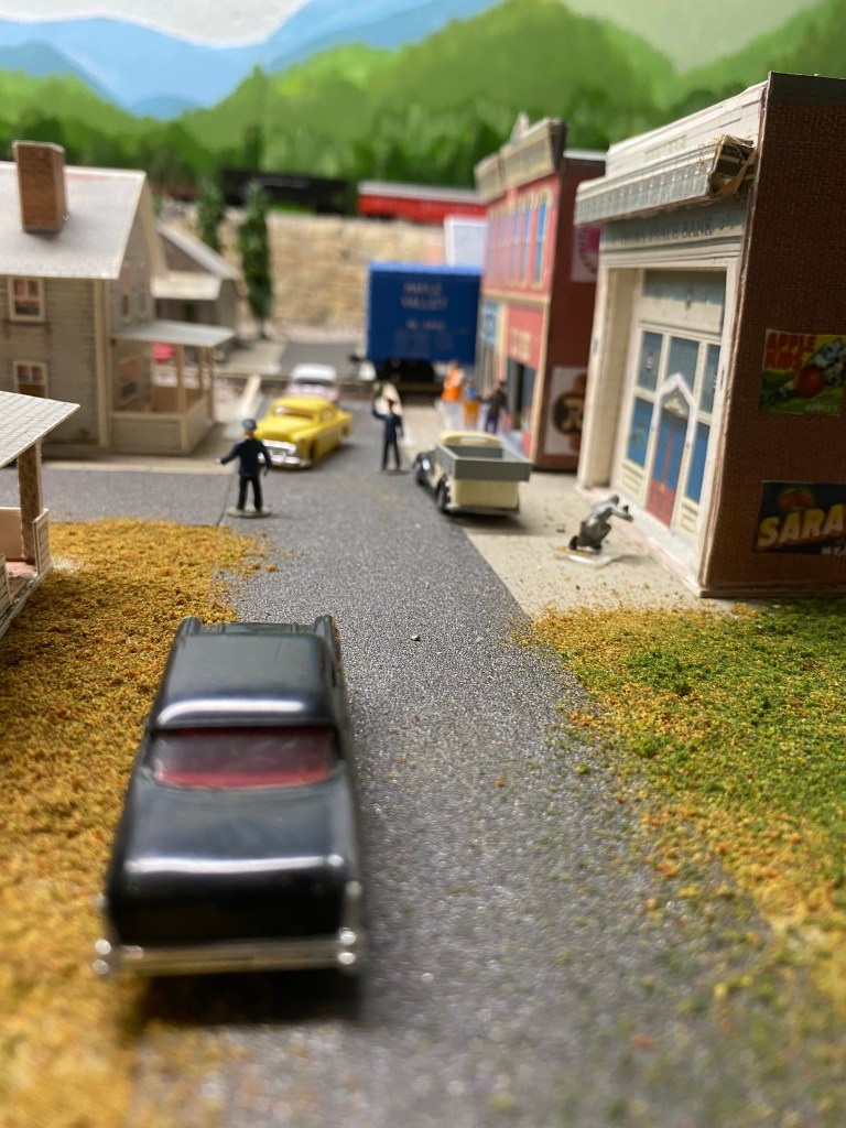 Street scene with cars and buildings.