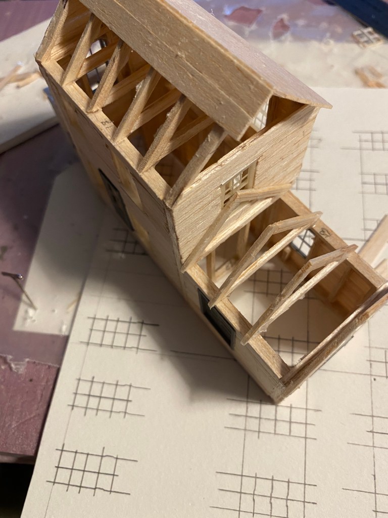 Looking down in balsa roof trusses in two story building.
