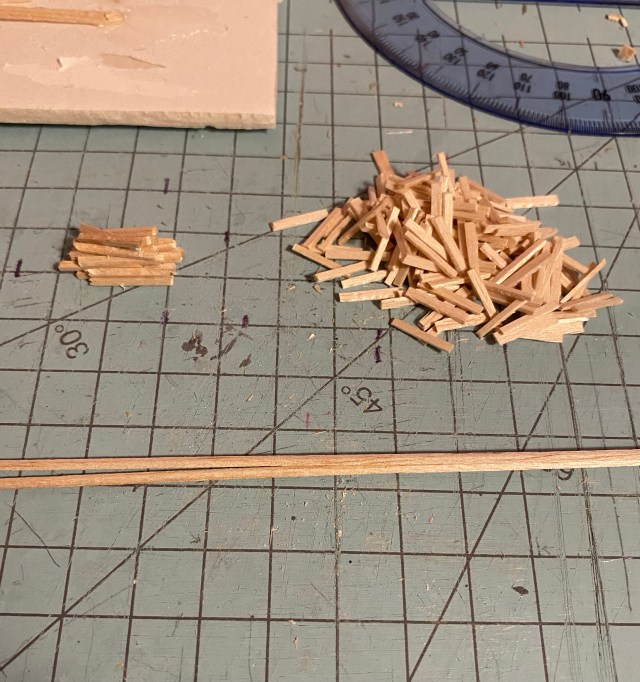 Cutting board, ruler, balsa pieces for fence.