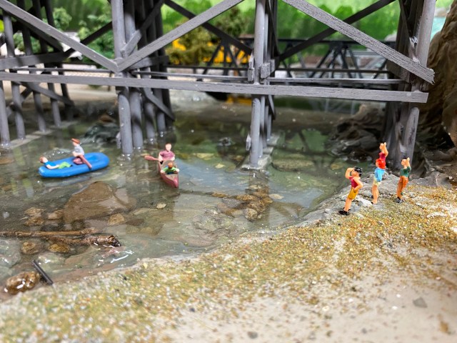 Maple Valley River with canoers and swimmers watching.