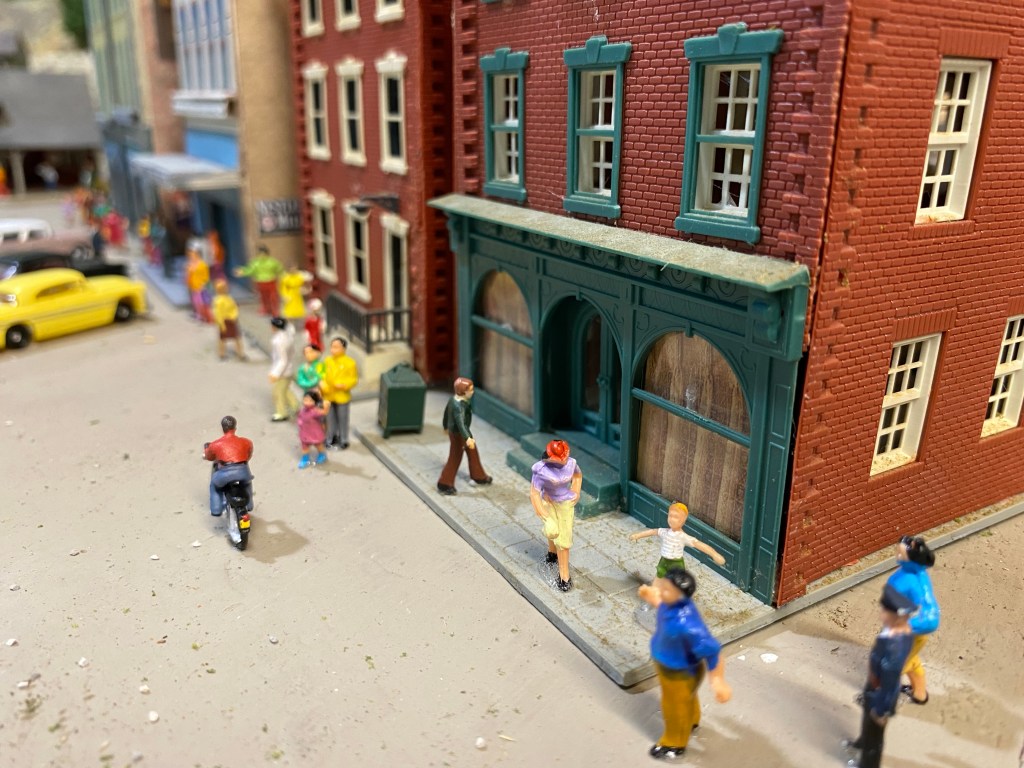 People walking along street.