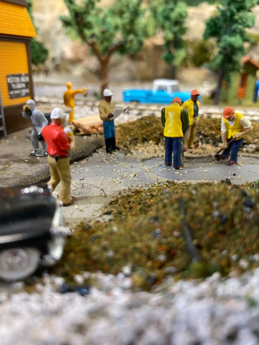 Sheriff Terkinberry, wearing work clothes, approaches site where bones were found.
