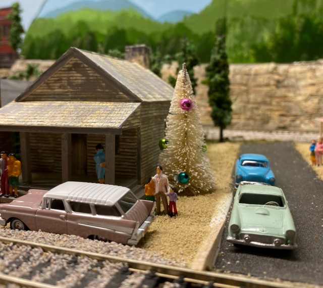 Houses, streets, car, Christmas tree, people