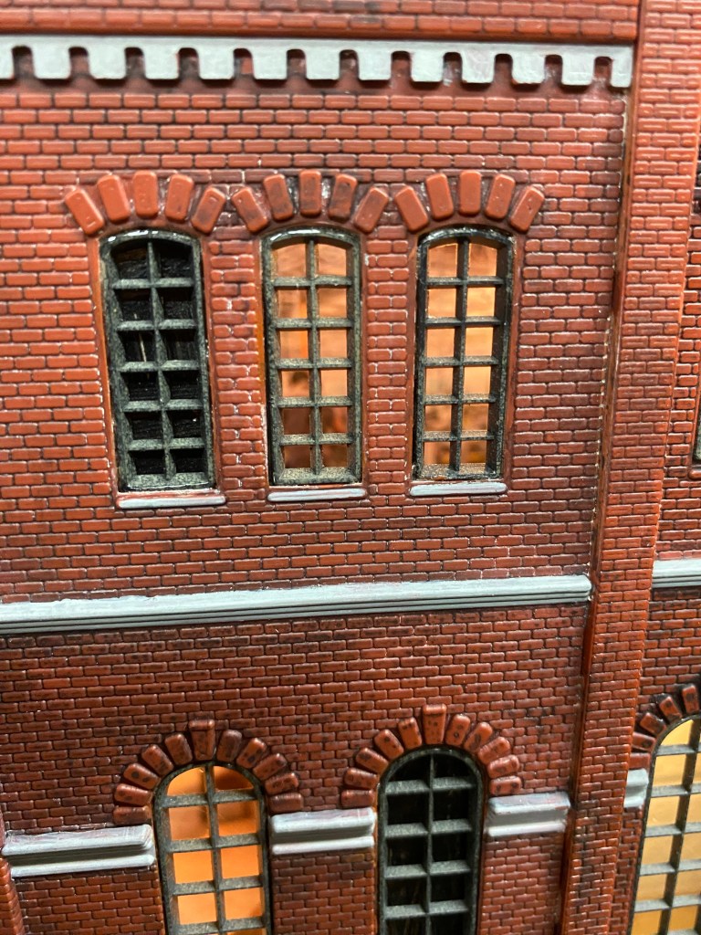 The lights are on at Maple Valley Manufacturing with detail of the interior of the building.