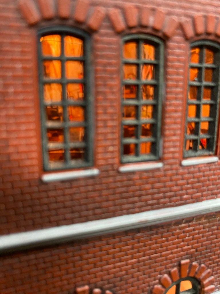 A close up view of the interior of the Maple Valley Manufacturing Plant with work benches and supplies visible.