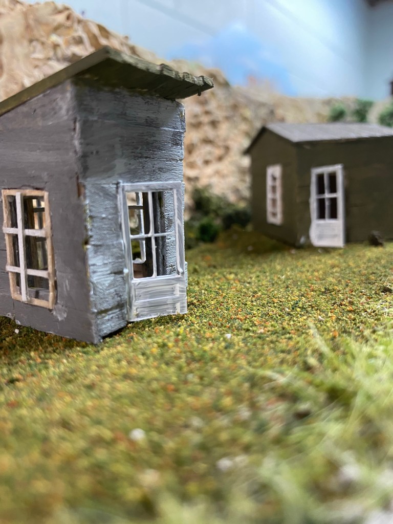 Two small sheds in front of Maple Valley Ridge and also near the river.
