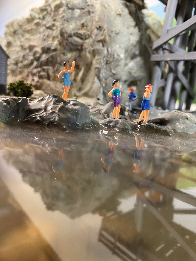 The water is calm on Maple Valley River and swimmers are enjoying a summer day.