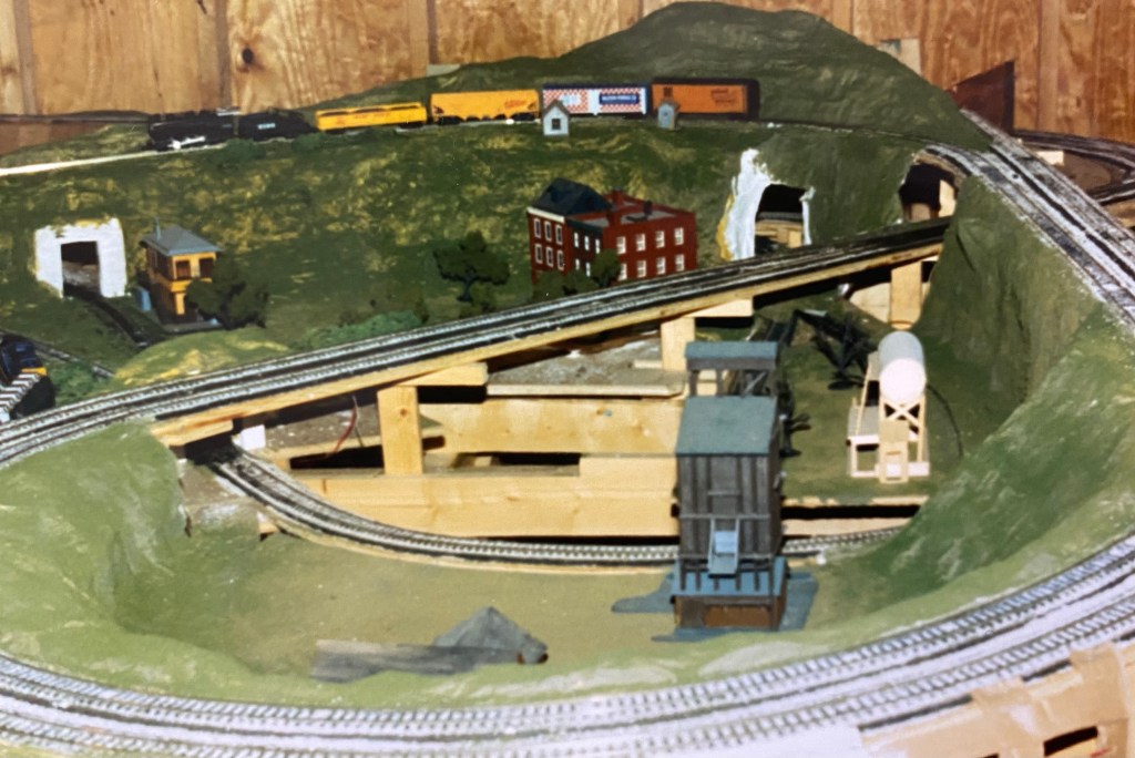 Benchwork, track, plaster, ground cover, buildings, train