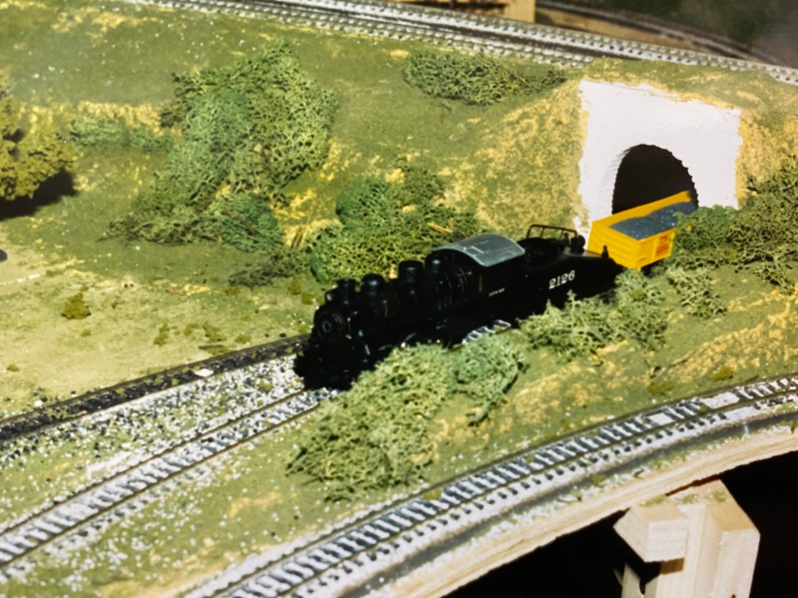 Small train moving through tunnel