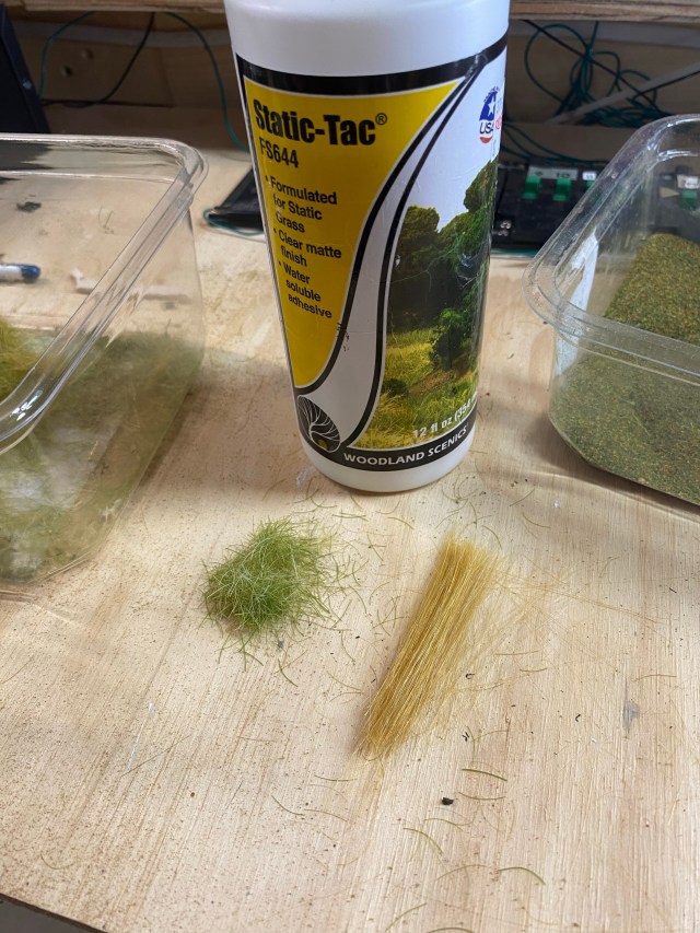 Woodland Scenics Static-Tac and grass clippings