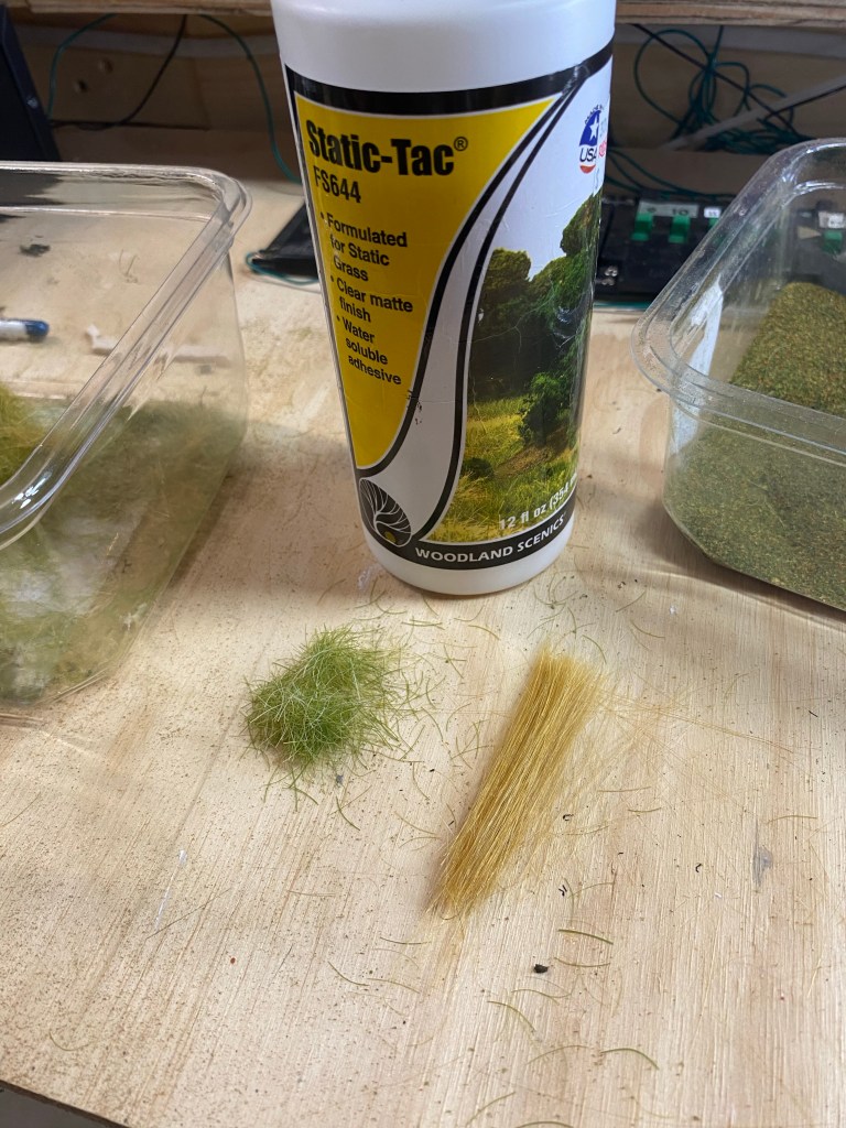 Woodland Scenics Static-Tac and grass clippings