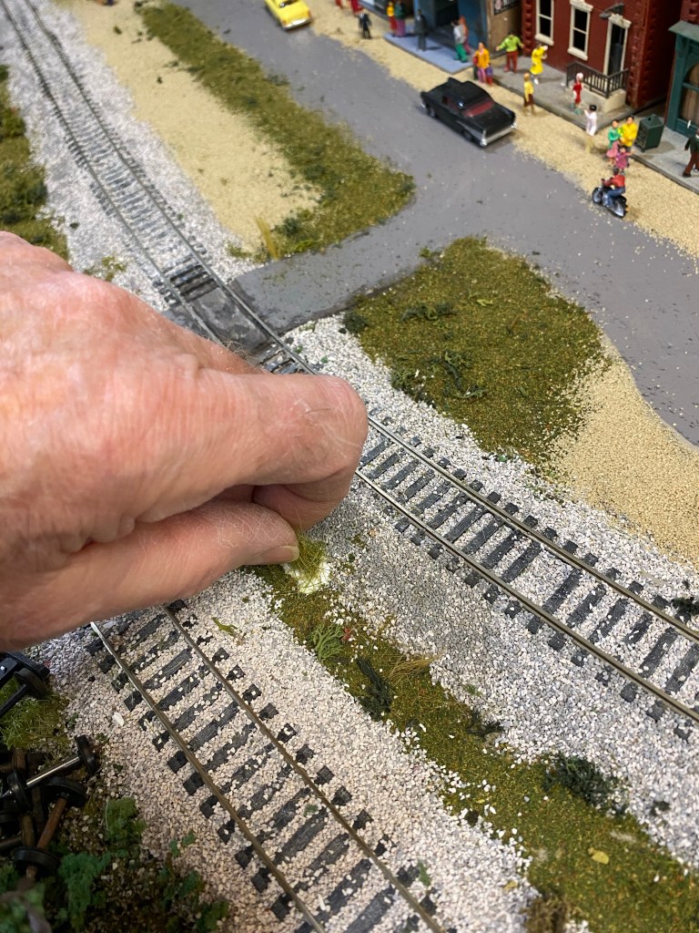 Woodland Scenics grass planting, tracks, road, cars, people