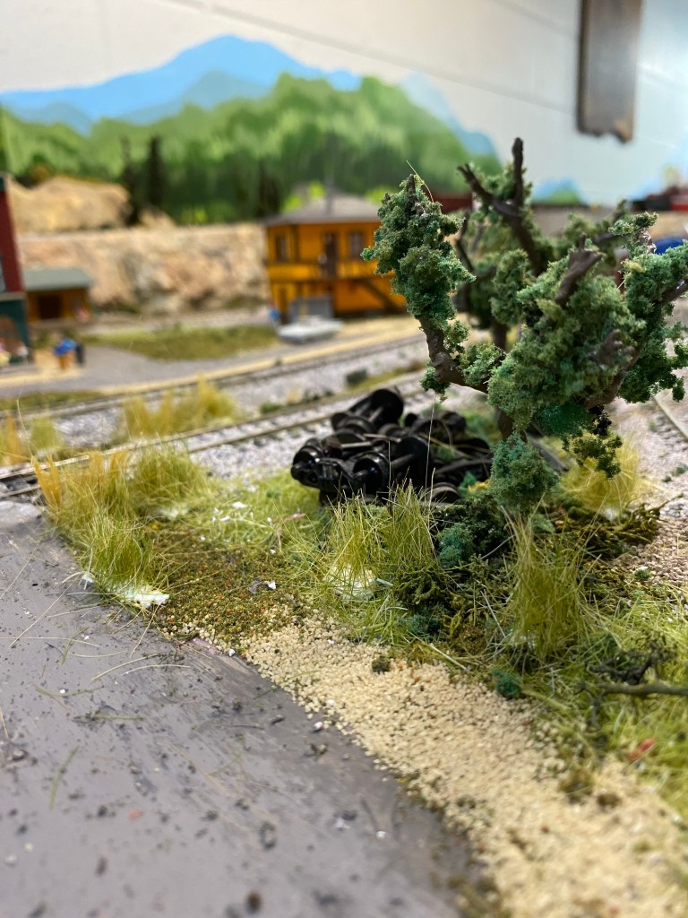 Railroad tracks, Woodland Scenics grass, junk, trees