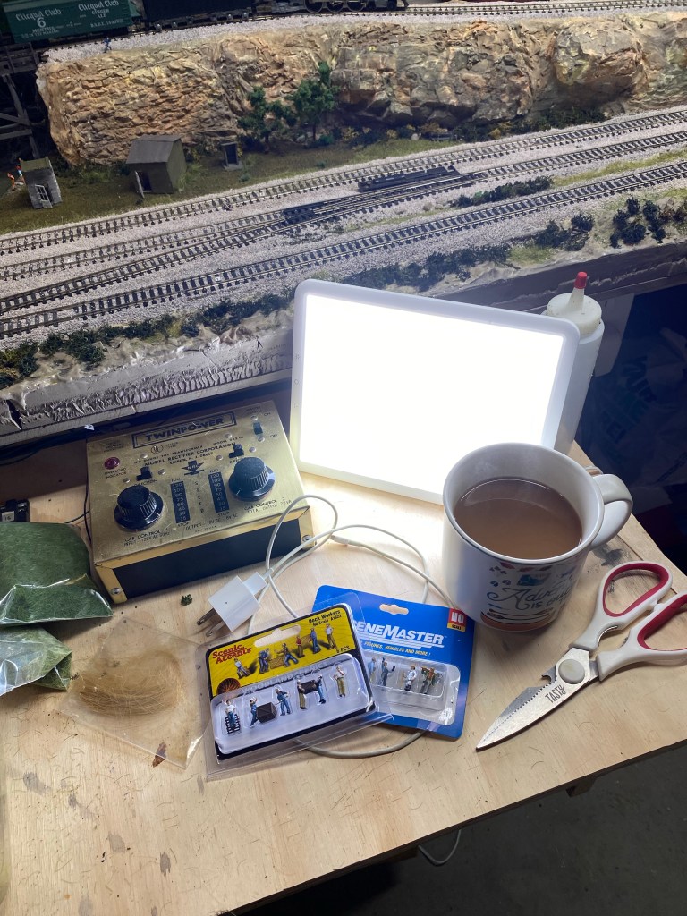 Sunlight lamp, coffee cup, train tracks, scissors, transformer