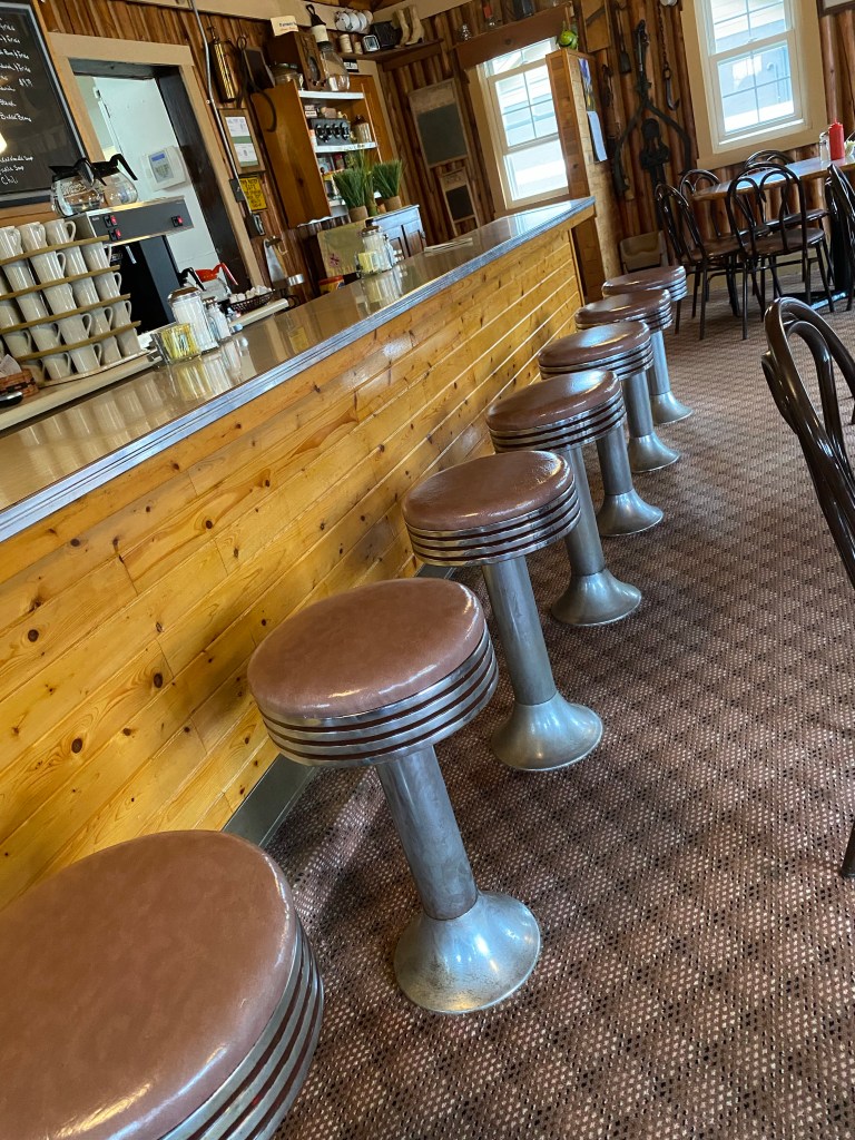 Snack bar stools, pine front, counter, shelves, windows