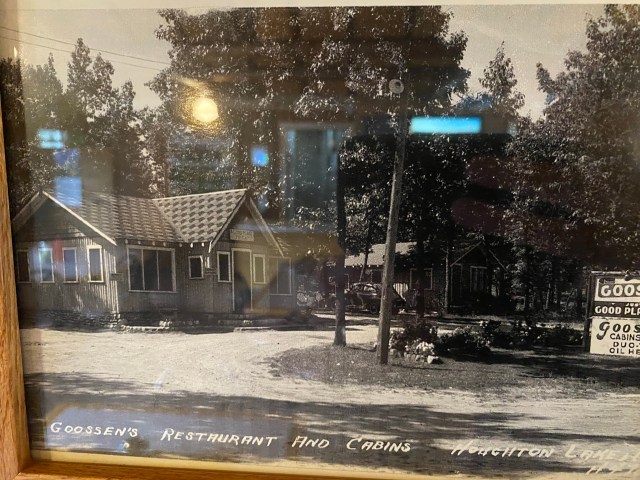 Black and white photo, vintage cabin, trees