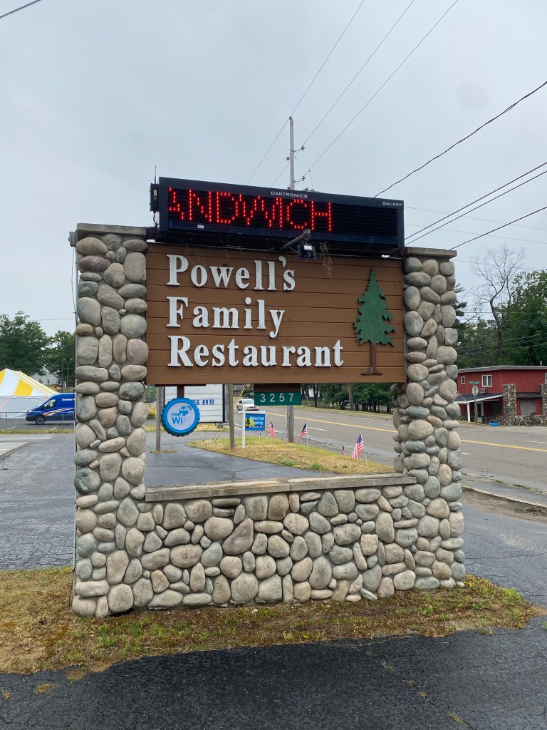Sign for Powell's Family Restaurant made of stone