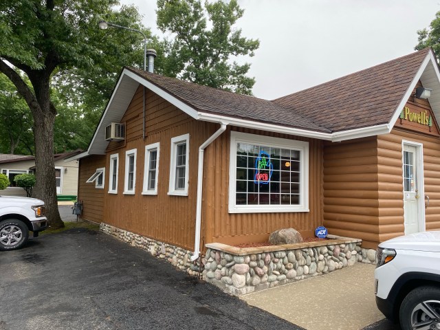 Flip-up window, five more windows and door of Powell's Restaurant