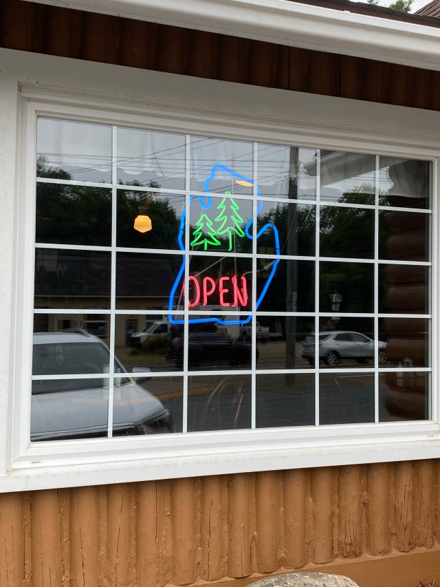 Large pane window, "Open" Michigan neon sign