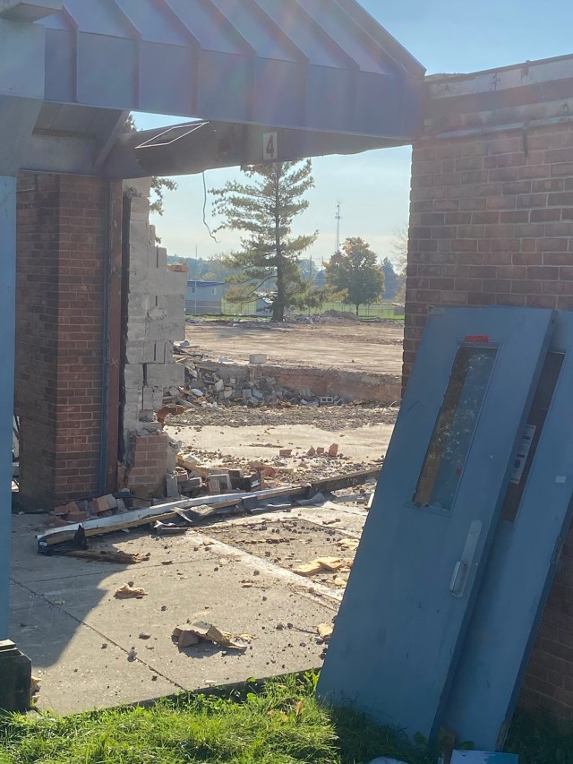 Building doorway, open space, bricks, rubble