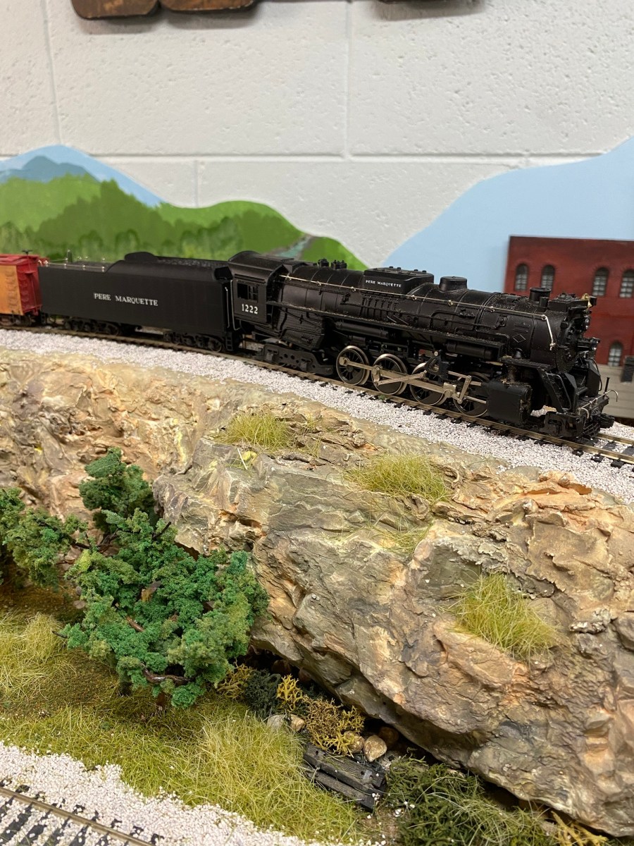 HO Scale 2-8-4 steam engine, rocks, scenery, tracks