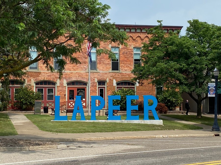 Lapeer sign, building, trees, windows, doors, street, sidewalks