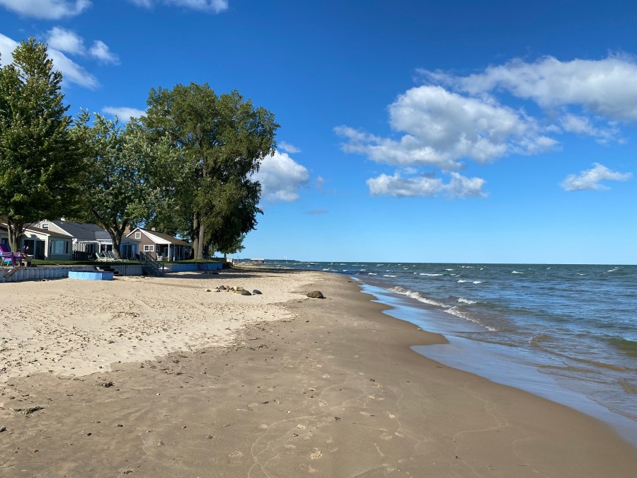 Sand, white clouds, water, cottages