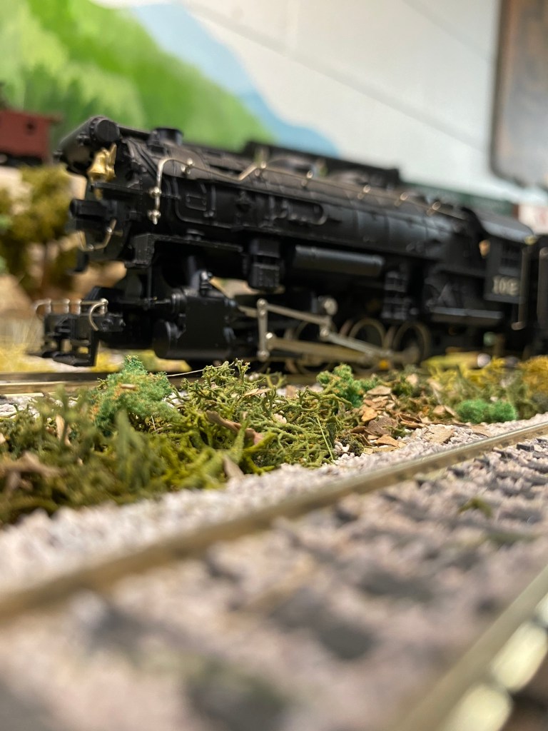 Steam engine, train track, grass, stones