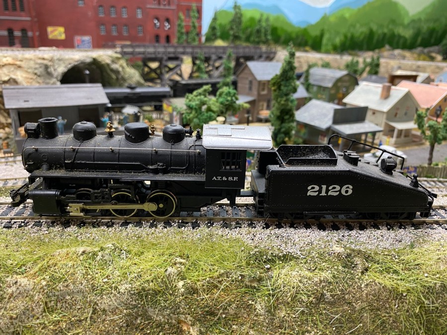 0-3-0 Steam Engine, weeds, houses, track