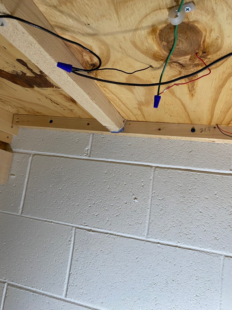 Under layout, benchwork, plywood, 1x1 support piece, wires.