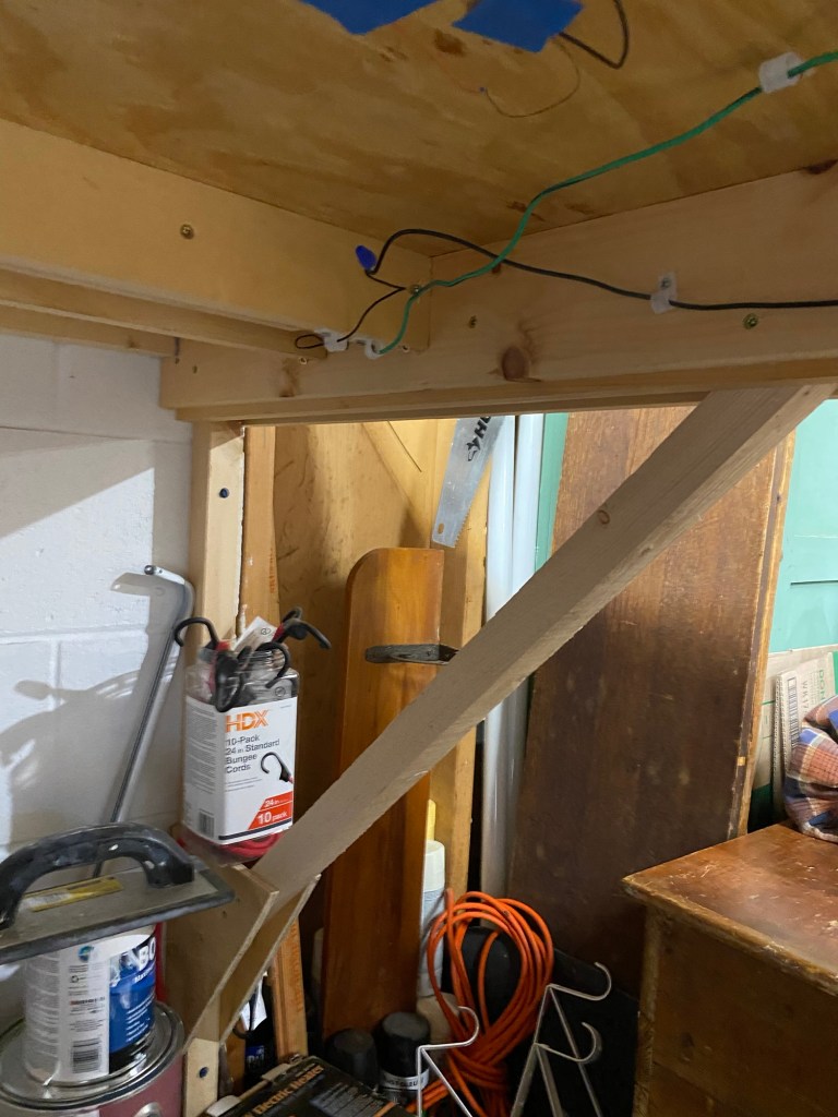 Wall bracket, plywood table top, girders, wires